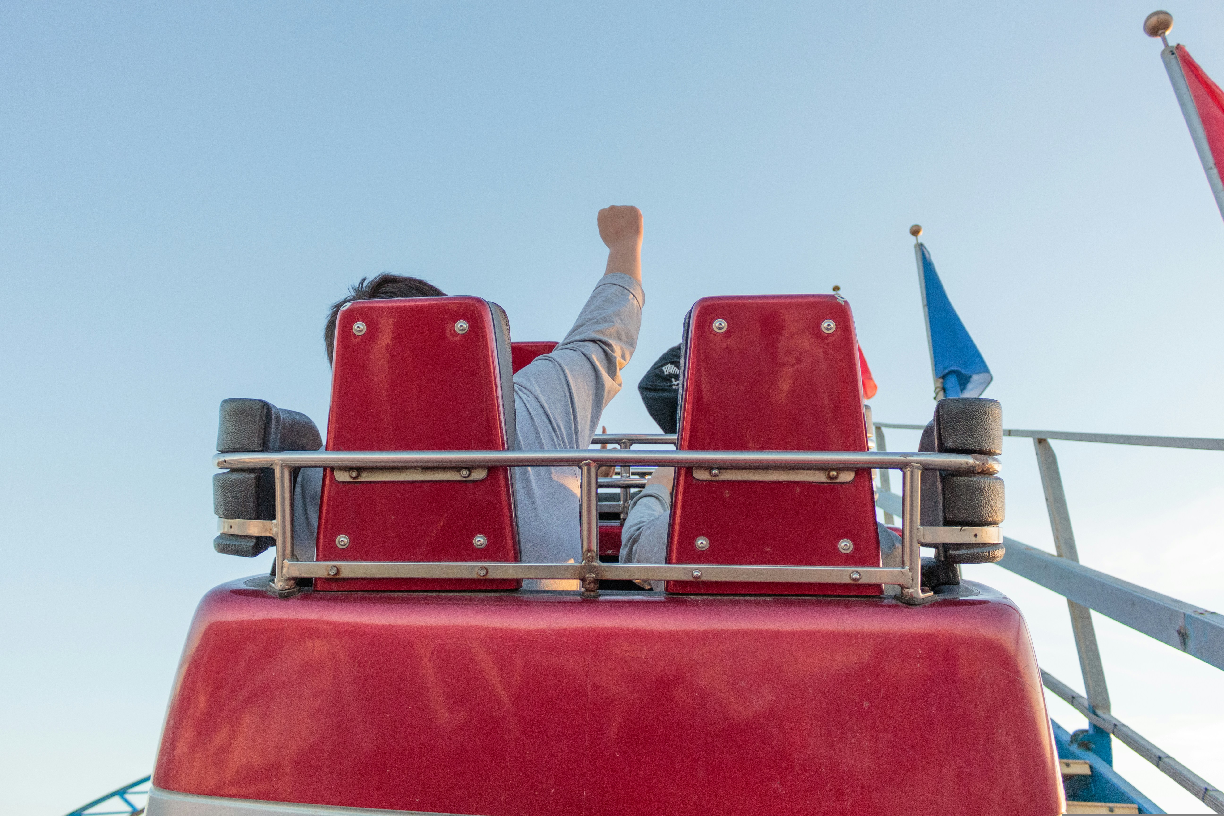 man and son on red rollercoaster